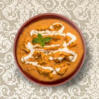 Butter Chicken · Chunks of grilled chicken cooked in a smooth buttery & creamy tomato-based gravy. Served wit...