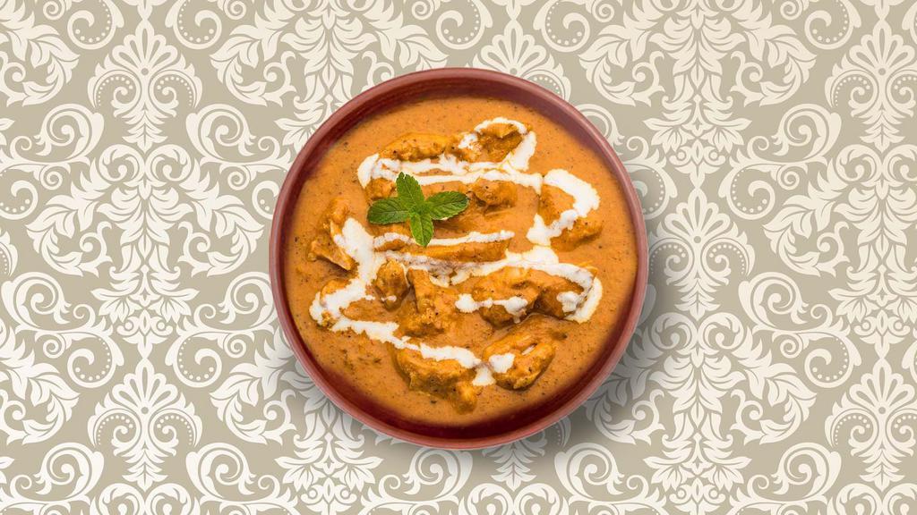 Butter Chicken · Chunks of grilled chicken cooked in a smooth buttery & creamy tomato-based gravy. Served with a side of aromatic white rice.
