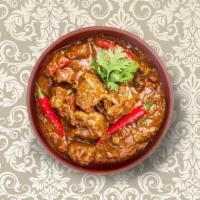 Clay Pot Lamb Curry  · Pieces of lamb stewed in an onion- and tomato-based gravy, flavored with ginger, garlic, chi...