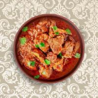 Traditional Lamb  Vindaloo · Marinated lamb chunks cooked in Goan sauce made from caramelized onions, curry paste, coconu...
