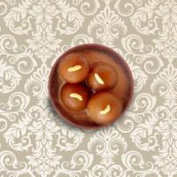 Gulab Jamun · Deep-fried soft dumplings made of dried milk, steeped in flavored sugar syrup.