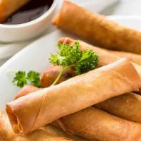 Crispy Spring Rolls · Two Pieces wrapped in fried rice paper, stuffed with chicken. Served with sweet chili sauce.