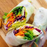 Veggie Summer Rolls · Two pieces wrapped in rice paper and filled with veggies.