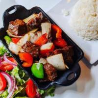 Shaky Beef · Tenderloin cubed cuts of beef flambe' marinated in our special seasoning served with our hou...