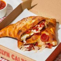 The Barclays Calzone · Calzone with sausage, pepperoni, bacon, ham, melted mozzarella, and a side of marinara.