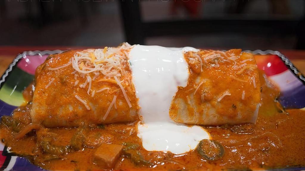 Picante Burrito · Spicy. Very spicy. Choice of meat, beans, rice, avocado salsa, pico de gallo, guacamole, and cheese. Then topped with spicy ahogada salsa and sour cream.