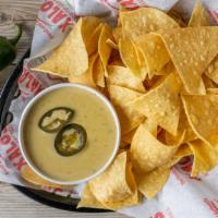 Jalapeno Queso Dip · Xalos special creamy Jalapeno Queso Dip. Served whit Chips.
