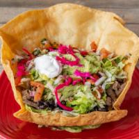 Super Taco Salad · Choice of meat or vegetarian, served in a large flour tortilla shell or barefoot in a bowl. ...