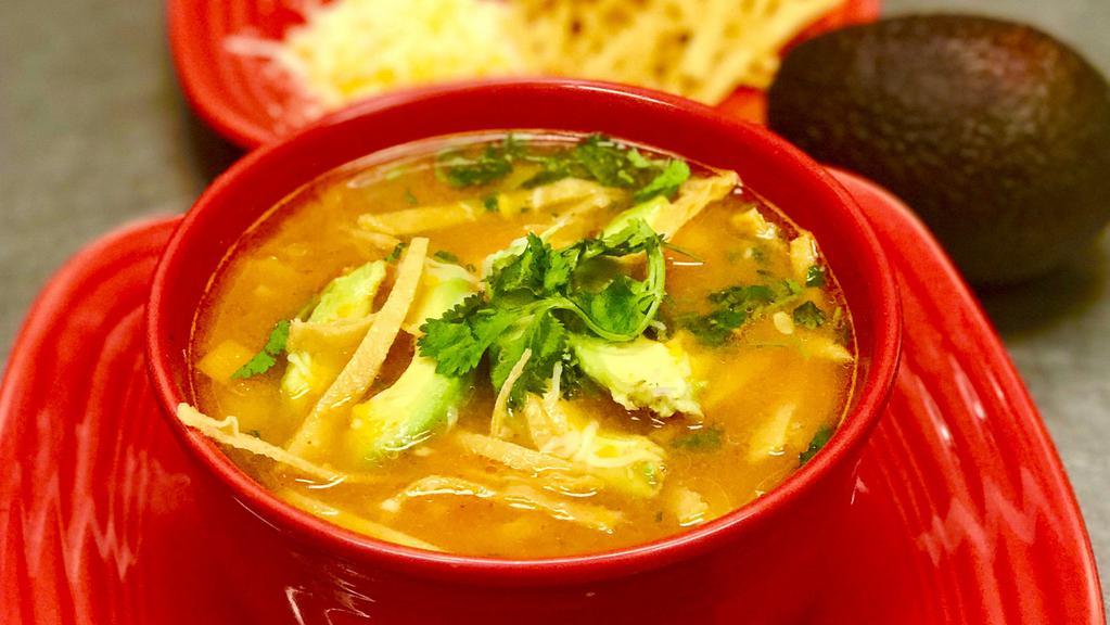 Chicken Tortilla Soup · Our popular chicken and vegetable soup topped with tortilla strips, cilantro, cheese and avocado.