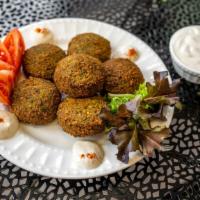 Falafel · Crushed chickpeas mixed with fine parsley, garlic, olive oil with zesty Mediterranean spices...