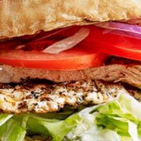 Elliott Grilled Chicken Burger · Marinated with Mediterranean spices comes with lettuce, tomato, onion served on a fresh brio...