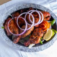 Tandoori Chicken · Chicken on the bone marinated with spices and grilled in the clay oven.
