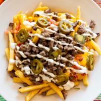 Poblano Fries · Choice of steak, chicken, or al pastor with cheese sauce, pico, jalapeños, and sour cream.