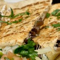 Quesadilla · All 12” quesadillas come with meat and cheese. Choice of steak, chicken, carnitas or al past...