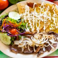 Chalupa · Tortillas covered with red or green salsa, topped with fresh cheese, and sour cream, with ri...