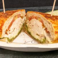 Pat'S Panini · Herb roasted chicken and fresh mozzarella grilled on herb focaccia bread with pesto and toma...