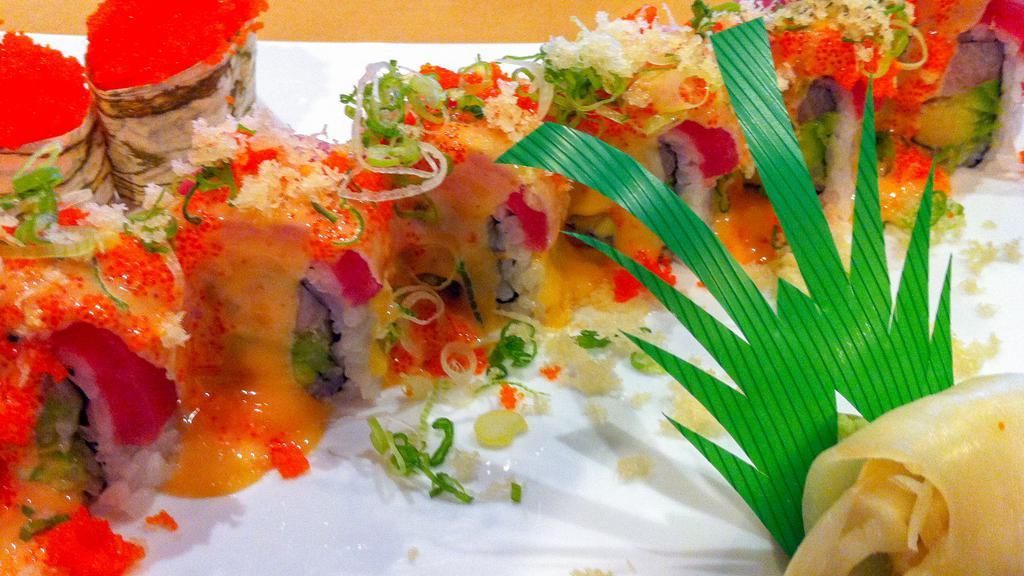 Marla Roll · Yellowtail, avocado, tempura flakes topped with tuna, spicy sauce, scallions, tempura flakes, and massago.