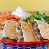 Quesadilla · All quesadillas are served with a side of sour cream, lettuce and tomatoes.