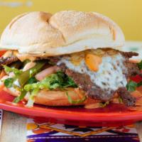 Cubana Torta · A Mexican sandwich with a combination of egg, chorizo and carnitas. With homemade chipotle m...