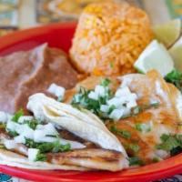 Fish Tacos · Three tilapia tacos topped with onions and cilantro. Serve with rice and beans. Your choice ...