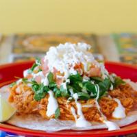 Tinga Taco · Marinated chicken. Topped with chopped onions and cilantro. Your choice of corn or flour tor...