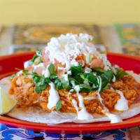 Carnitas Taco · Topped with chopped onions and cilantro. Your choice of corn or flour tortilla.