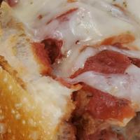 Meatball Parmigiana Sandwich · Meatballs, red sauce, mozzarella, and Romano cheese. Homemade.