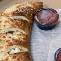 Plain Calzone (Small) · Calzones have ricotta cheese and sauce on the side.