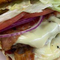 Hungry Hippo Burger · Two patties, extra cheese, bacon, lettuce, tomato, and red onion with a mix of ketchup and s...