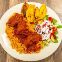 Jollof Rice Dinner · Steamed white rice blended in red stew served with your choice of goat meat and fish.