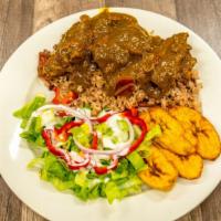 Curry Goat · Tender grilled goat in curry spices. Served with choice of side.
