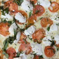 Large Fresca Pizza · Ricotta, mozzarella cheese and freshly sliced tomatoes.