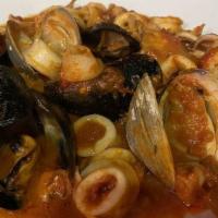 Vongole Al Forno · Clams baked with signature stuffing topped with silvers of Italian bacon.