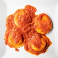 Ravioli Al Formaggio · Ricotta ravioli served with your choice of house marinara or traditional bolognese sauce.