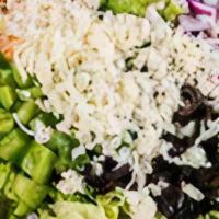 Family Sized Garden Salad · Romaine Lettuce, Green Peppers, Red Onions, Black Olives, Tomatoes and Mozzarella Cheese