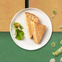 Grilled Cheese Sandwich · Melted American cheese between two slices of buttery grilled bread.