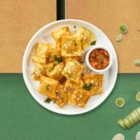 Fried Ravioli  · (Vegetarian) Cheese-filled ravioli breaded and fried until golden brown. Served with housema...