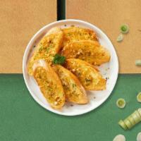 Garlic Bread  · (Vegetarian) Housemade bread toasted and garnished with butter, garlic, mozzarella cheese, a...