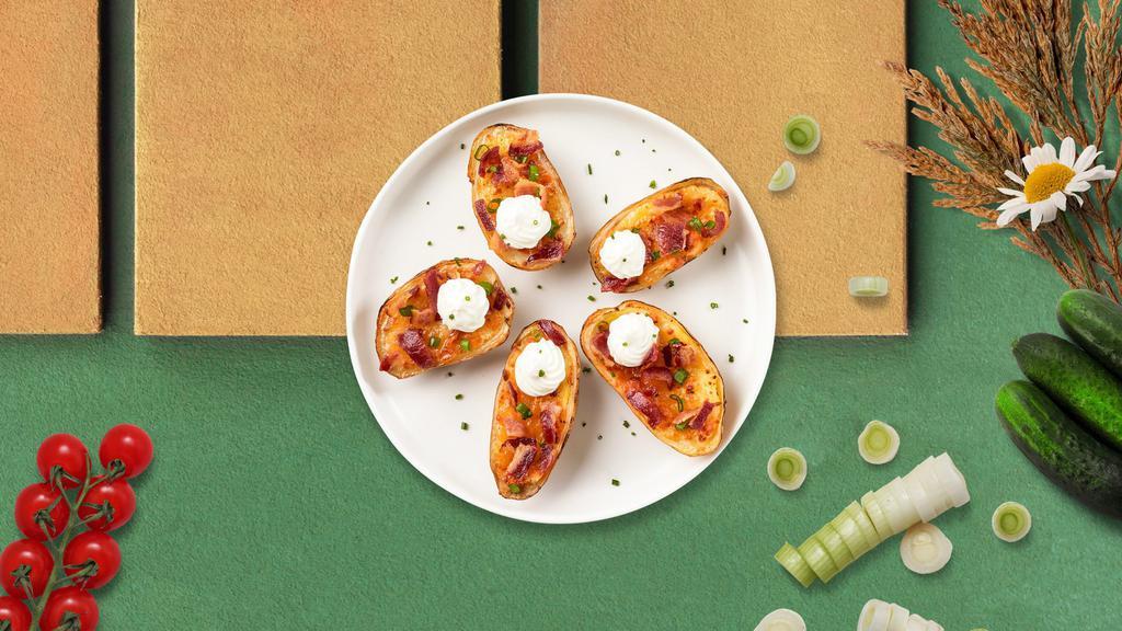 Plain Potato Skins  · Baked potato skins filled with cheddar cheese, bacon, scallions, and topped with sour cream.