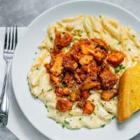 Buffalo Mac & Cheese · Our fresh made four cheese blend tossed with penne pasta and topped with our famous spicy bu...