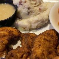 Country Fried Chicken Dinner · A true Home Plate favorite! A heaping portion of lightly breaded boneless fried chicken smot...