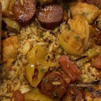 Portuguese Chicken · A spicy treat! Sautéed chicken with chorizo, onions, and tomatoes finished in a Mozambique s...