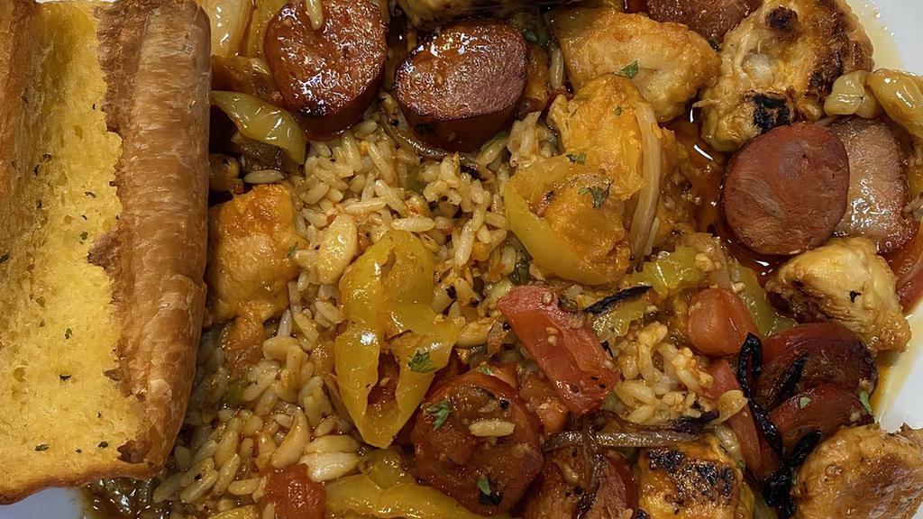 Portuguese Chicken · A spicy treat! Sautéed chicken with chorizo, onions, and tomatoes finished in a Mozambique sauce over rice pilaf. Also offered as mild.