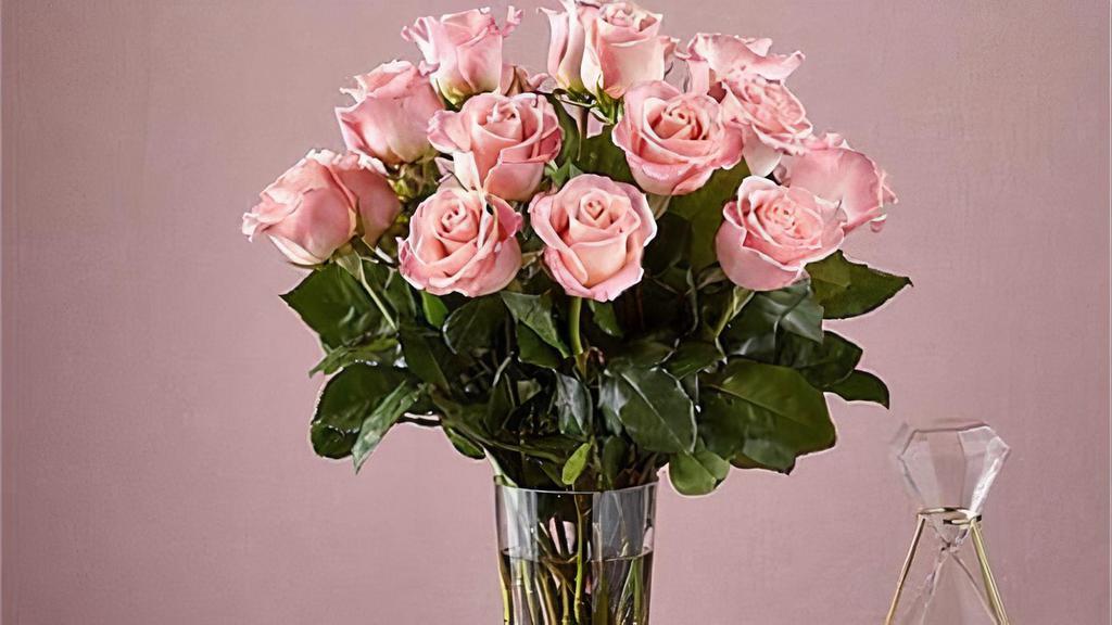 18 Long Stem Pink Roses · Enjoy the classic beauty of the rose with a playful twist in our Long Stem Pink Rose Bouquet. This arrangement features 18 pink roses that will look especially pretty in the hands of those you cherish most. Vase included. Item # E5440D