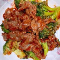 Beef With Broccoli (C) · Served with pork fried rice and pork egg roll.