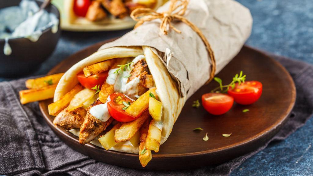 Ny Style Chicken Gyro Wrap · Roasted well marinated chicken with lettuce, tomato, onion and a drizzle of our fresh homemade secret sauce, wrapped in pita bread.