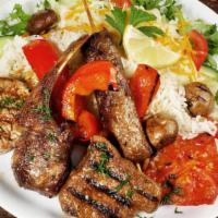 Lamb & Beef Gyro Platter · Fresh well marinated and perfectly juicy beef layered over a bed of Basmati rice and a side ...