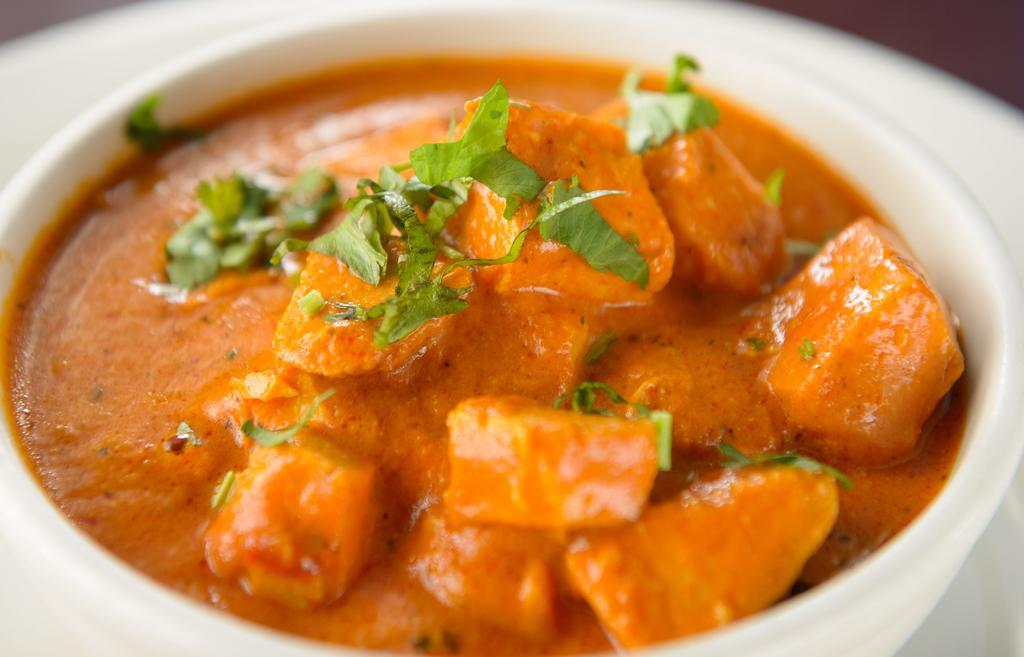 Chicken Tikka Masala   · Chicken in a popular curry made with tomatoes and fenugreek leaves.