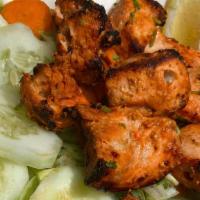 Chicken Tikka · Boneless chicken marinated in our homemade yogurt and rubbed with spices and cooked over cha...
