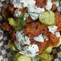 Nashville Hot Fried Chicken · Half bird, potato bread, Nashville hot dip, charred scallion ranch, pickles